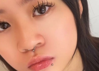 Close-up of a model with piercings at Huatlash, Singapore, Singapore, SG.