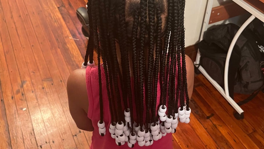 Beaded braids hairstyle at Elegance Beauty Bar LLC, Philadelphia, Pennsylvania, US.
