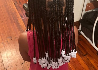 Beaded braids hairstyle at Elegance Beauty Bar LLC, Philadelphia, Pennsylvania, US.