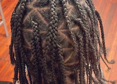 Intricate braided hairstyle at Elegance Beauty Bar LLC in Philadelphia, Pennsylvania, US.