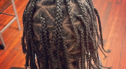 Intricate braided hairstyle at Elegance Beauty Bar LLC in Philadelphia, Pennsylvania, US.