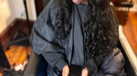 Client relaxing in a salon chair at Elegance Beauty Bar LLC, Philadelphia, Pennsylvania, US.