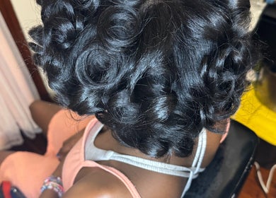 Stylish curled hair at Elegance Beauty Bar LLC in Philadelphia, Pennsylvania, US.
