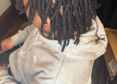 Client with stylish hair seated at Elegance Beauty Bar LLC, Philadelphia, Pennsylvania, US.