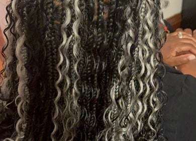 Intricate braided hairstyle at Elegance Beauty Bar LLC in Philadelphia, Pennsylvania, US.