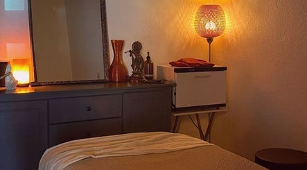 Cozy massage room at Massages & Relax, Willemstad, Curaçao, CW with warm lighting and inviting decor.