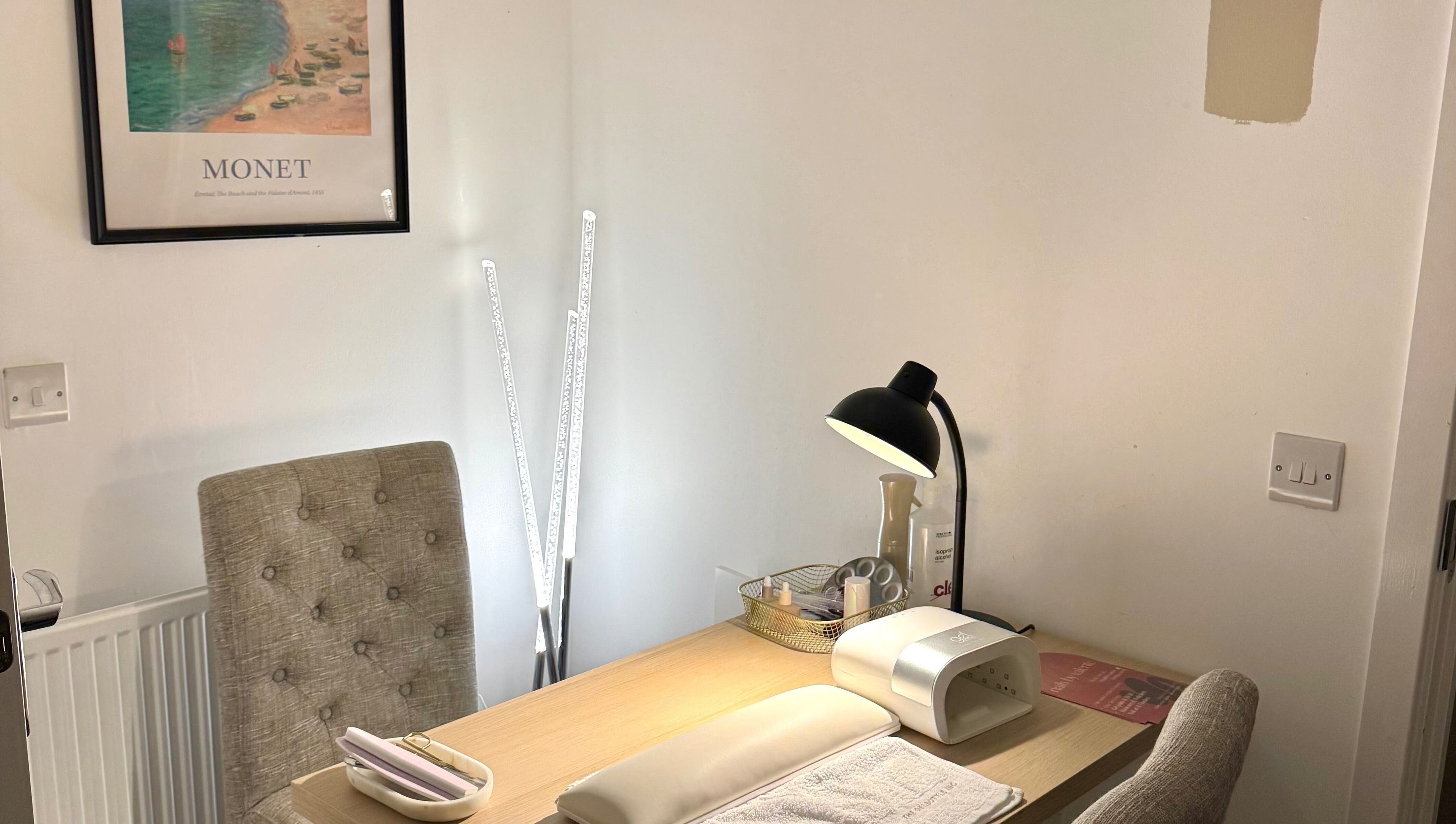 Nail workstation at Nails By Valente, Tranent, Scotland, GB. Features comfy chair, lamp, and supplies.