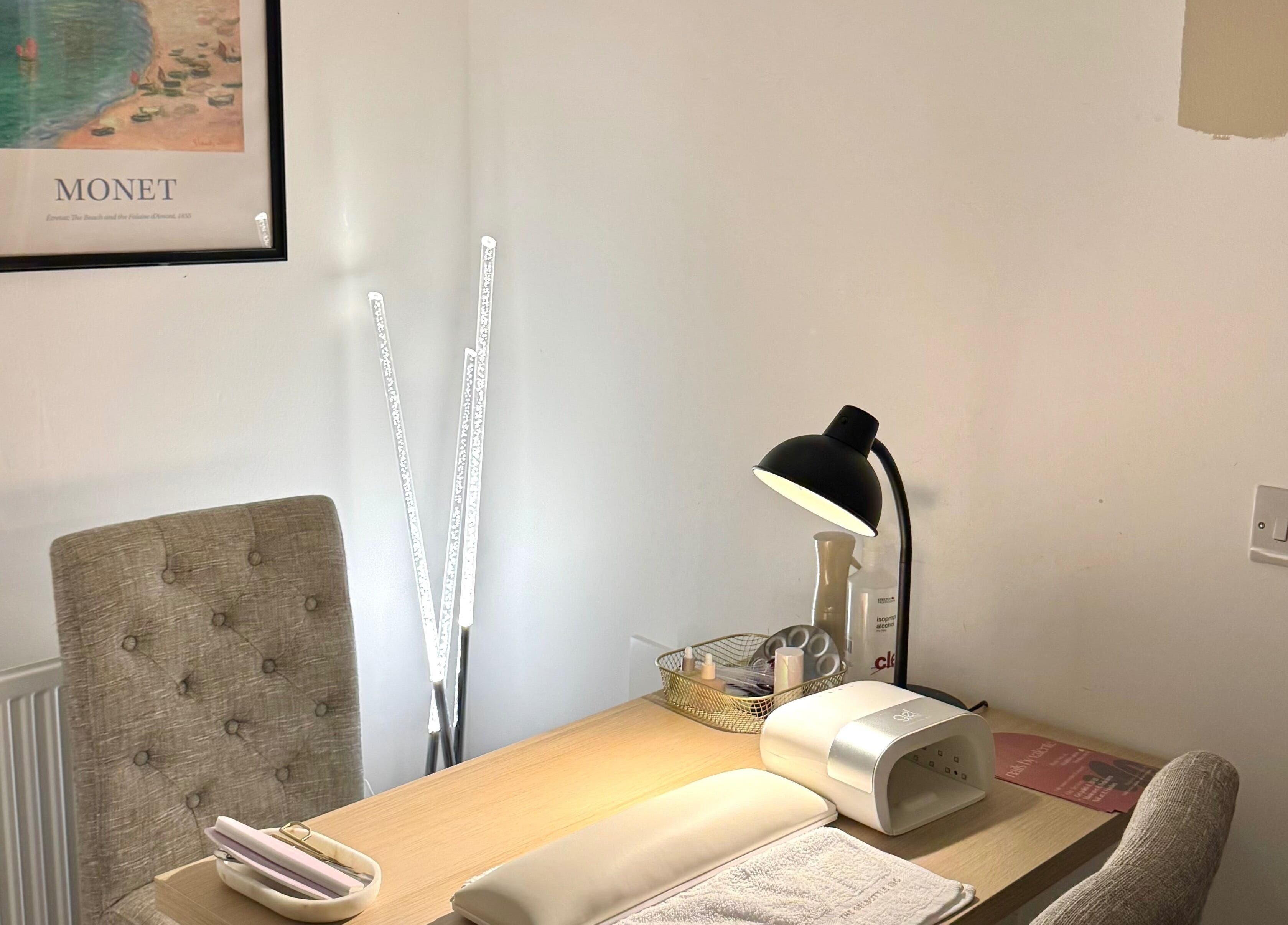 Nail workstation at Nails By Valente, Tranent, Scotland, GB. Features comfy chair, lamp, and supplies.