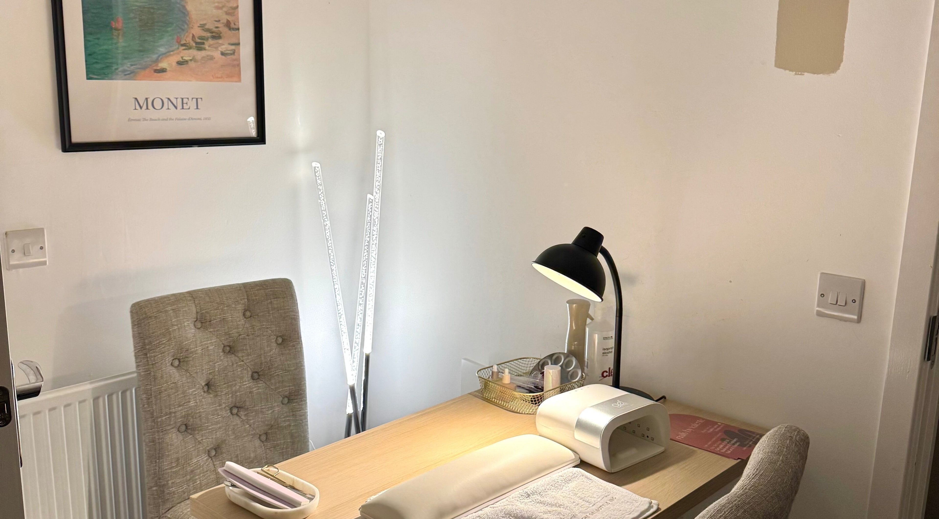 Nail workstation at Nails By Valente, Tranent, Scotland, GB. Features comfy chair, lamp, and supplies.