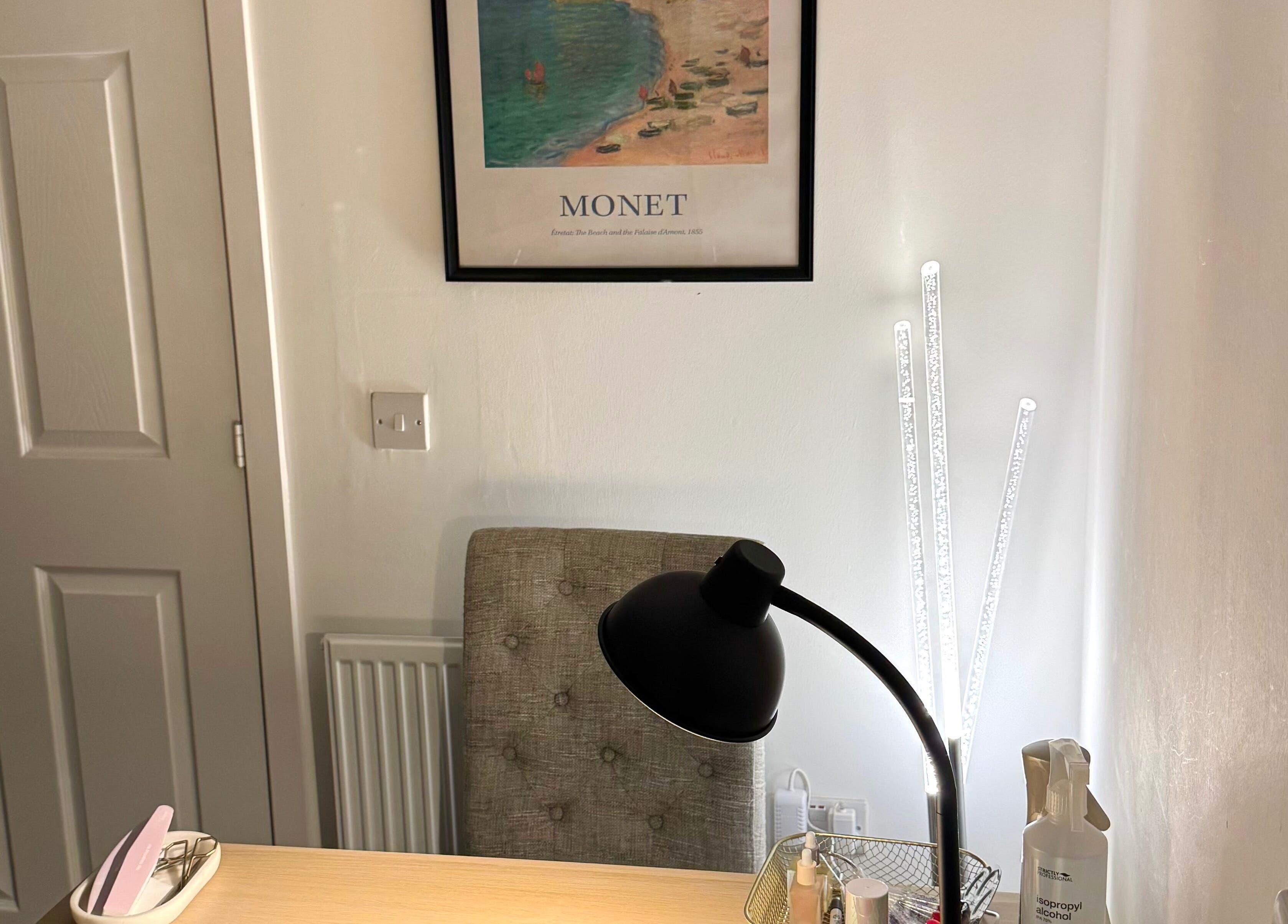 Nail station at Nails By Valente, Tranent, Scotland, GB with a modern lamp and Monet artwork.