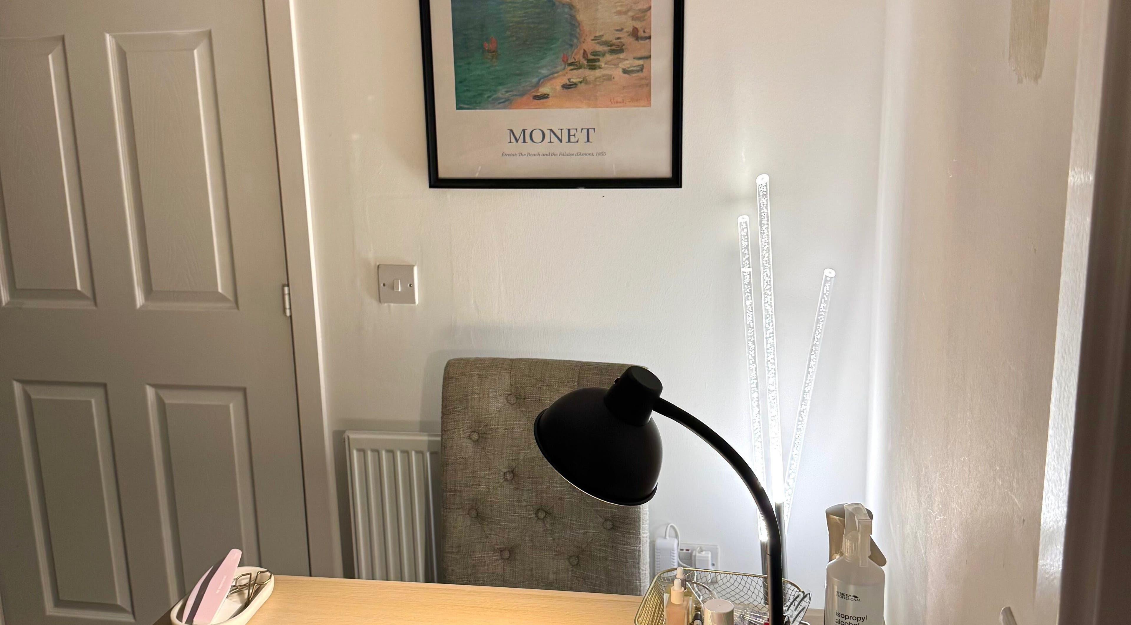 Nail station at Nails By Valente, Tranent, Scotland, GB with a modern lamp and Monet artwork.