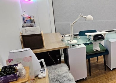 Cozy nail care station at Inner Doll Beauty, Melbourne, Victoria, AU, featuring a sleek desk and stylish decor.