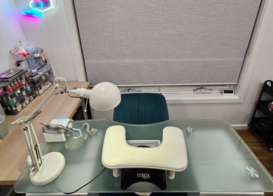 Modern nail treatment station at Inner Doll Beauty, Melbourne, Victoria, AU with glass desk and nail supplies.