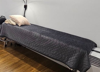 Relaxing treatment room at Inner Doll Beauty, Melbourne, Victoria, AU, featuring a comfortable massage bed.