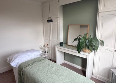Tranquil treatment room at Jessica's at Chichester, Chichester, England, GB with a massage bed and calming decor.
