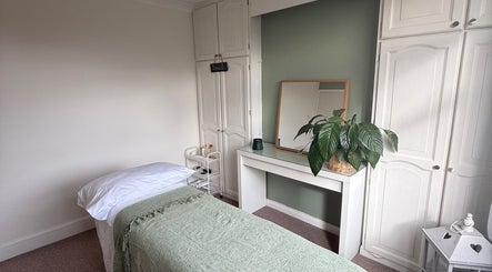 Tranquil treatment room at Jessica's at Chichester, Chichester, England, GB with a massage bed and calming decor.
