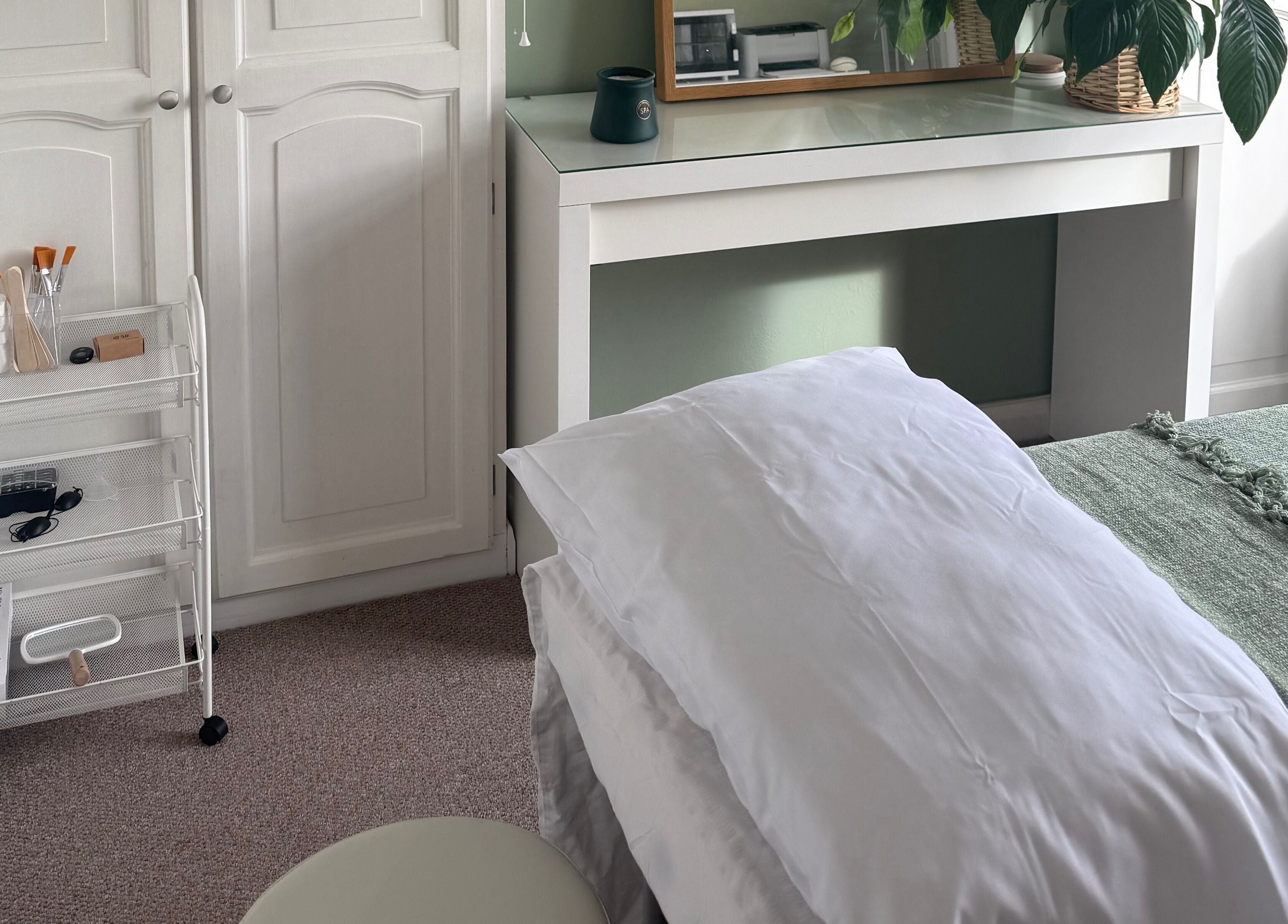 Calming treatment room at Jessica's at Chichester, featuring a bed and soothing decor in Chichester, England, GB.