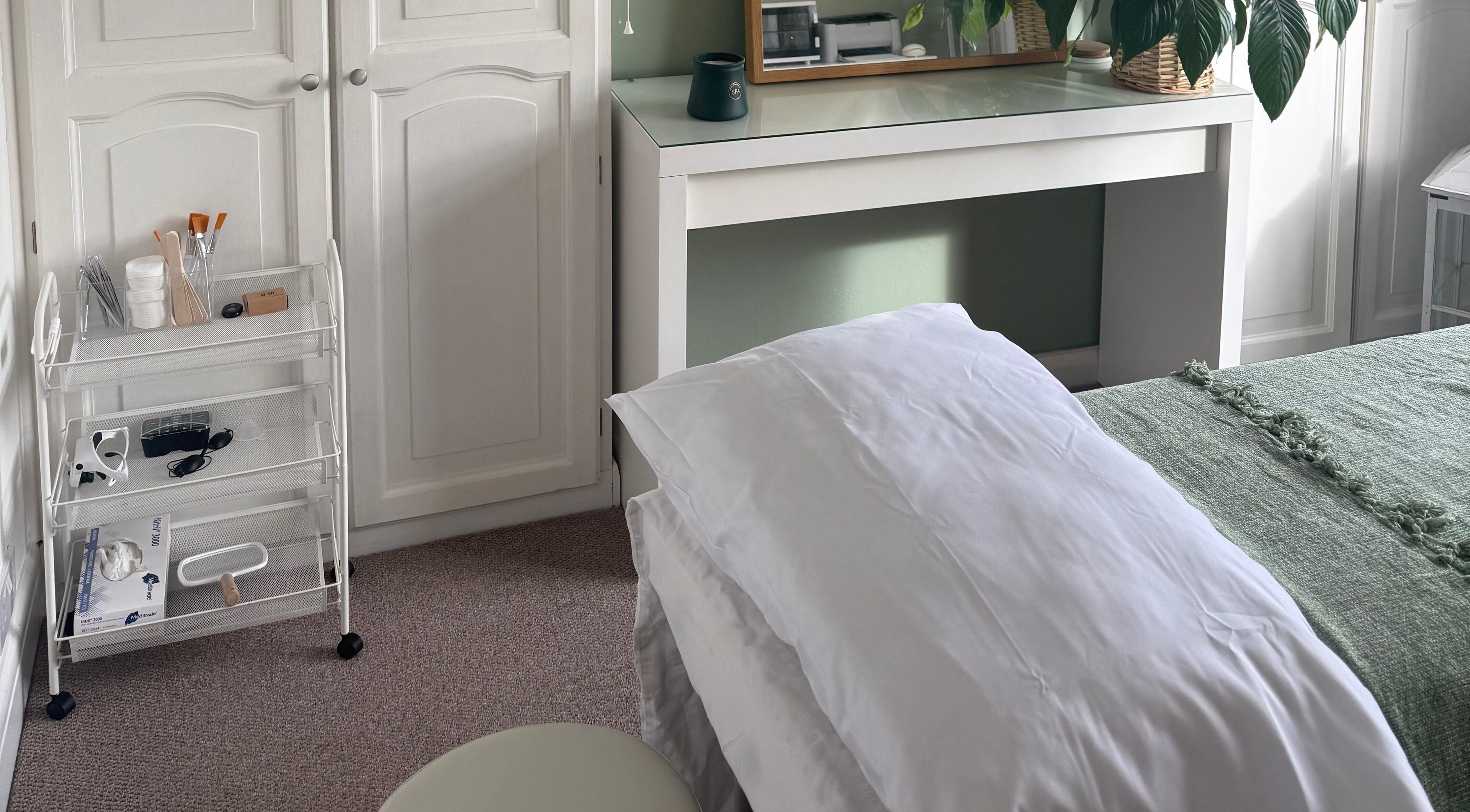 Calming treatment room at Jessica's at Chichester, featuring a bed and soothing decor in Chichester, England, GB.