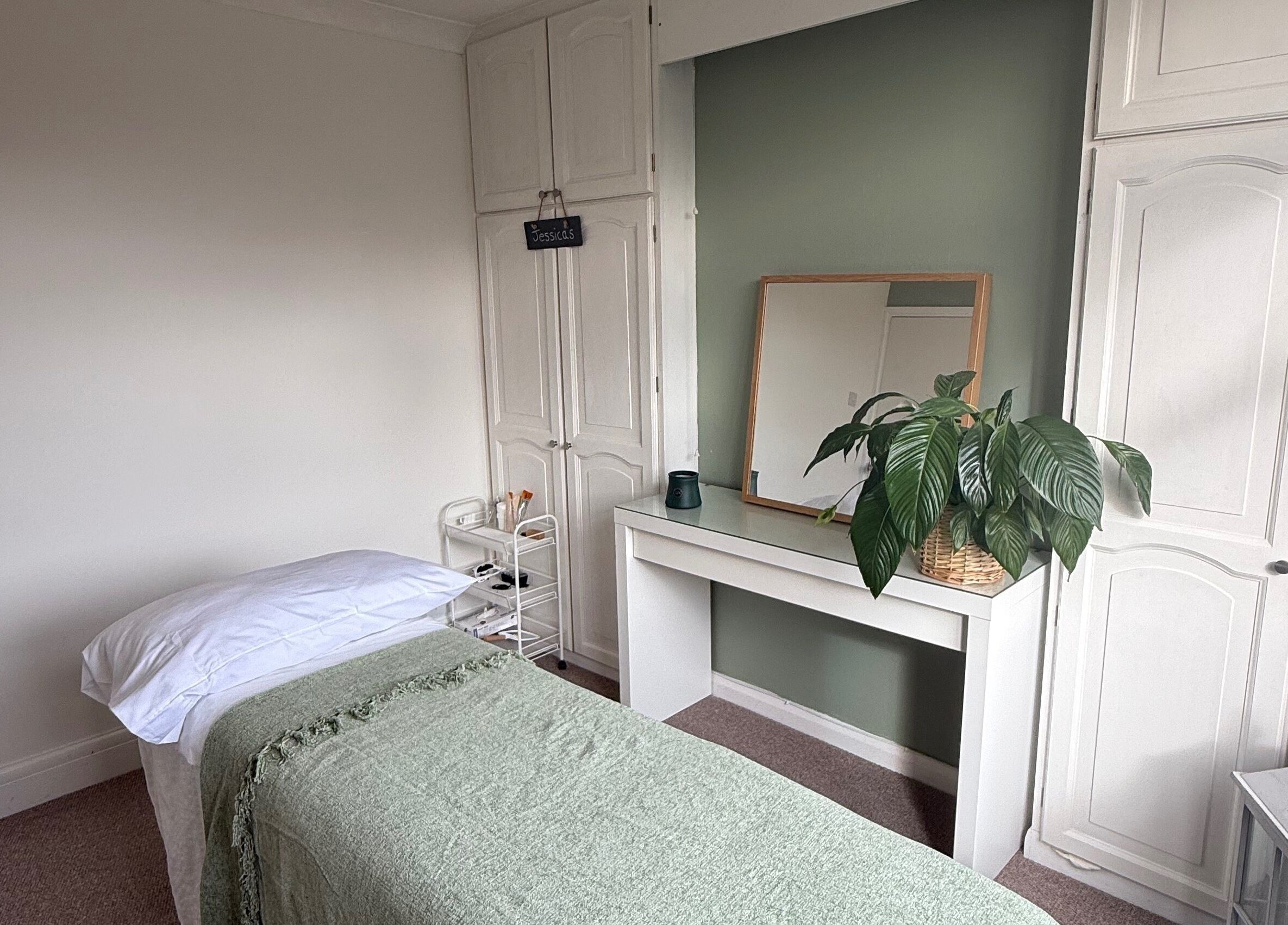 Calming treatment room at Jessica's at Chichester, Chichester, England, GB, featuring a massage bed.