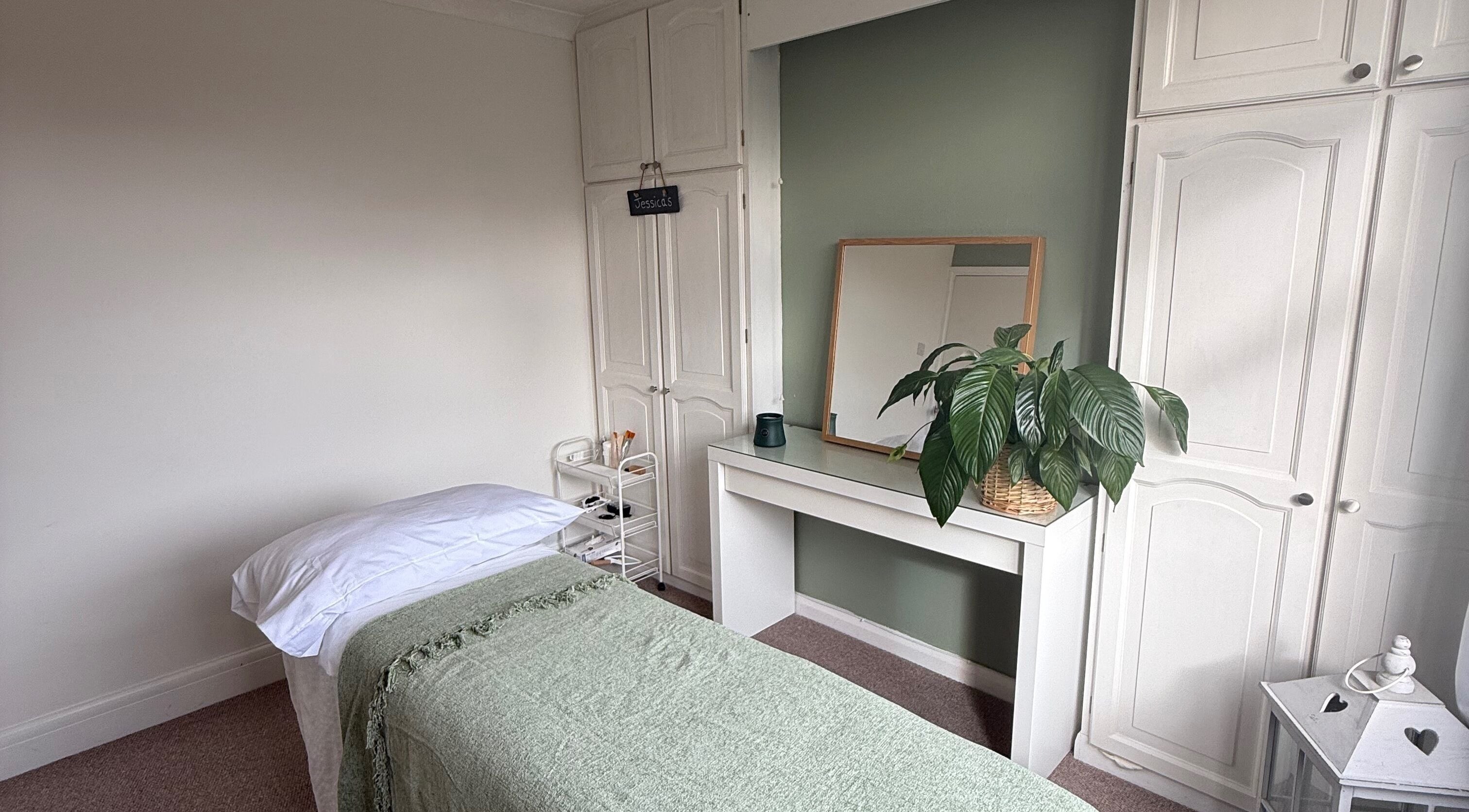 Calming treatment room at Jessica's at Chichester, Chichester, England, GB, featuring a massage bed.