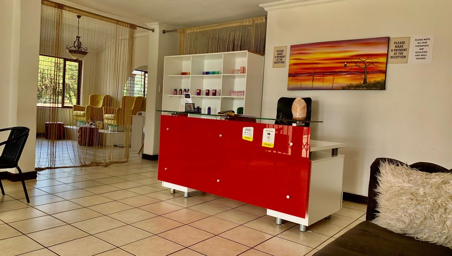 Reception area at SoulSpring Sports & Wellness Spa, Pretoria, Gauteng, ZA, showcasing a stylish red desk.