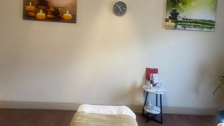 Relaxing massage room at Replay Massage, Cardiff, Wales, GB, featuring calming decor and a treatment bed.