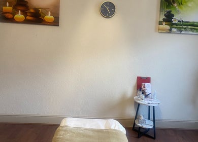 Relaxing massage room at Replay Massage, Cardiff, Wales, GB, featuring calming decor and a treatment bed.