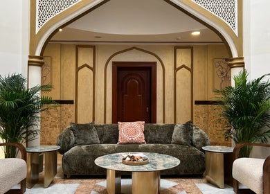 Elegant lounge at Naturelife Spa Al Mairid, Ras Al Khaimah, Dubai, AE with plush seating and lush plants.