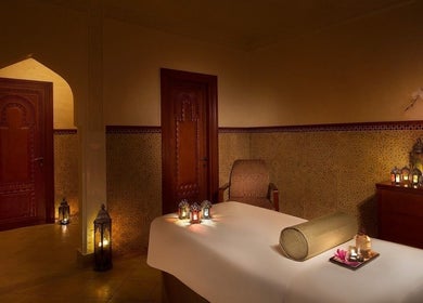 Cozy spa room at Naturelife Spa Al Mairid, Ras Al Khaimah, Dubai, AE, with ambient lighting and elegant decor.