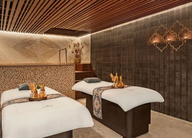 Luxurious treatment room at Naturelife Spa Premium, Dubai, Dubai, AE, featuring elegant massage tables.