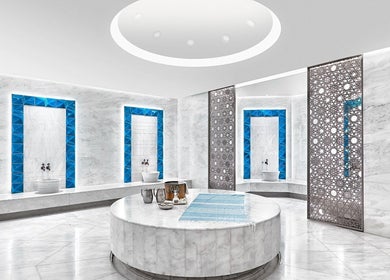 Luxurious marble spa room at Naturelife Spa Premium, Dubai, Dubai, AE with blue accents and serene decor.