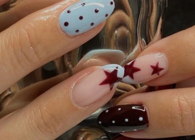 Elegant nail art with stars from June Studios, Edinburgh, Scotland, GB. Perfect for a stylish touch.