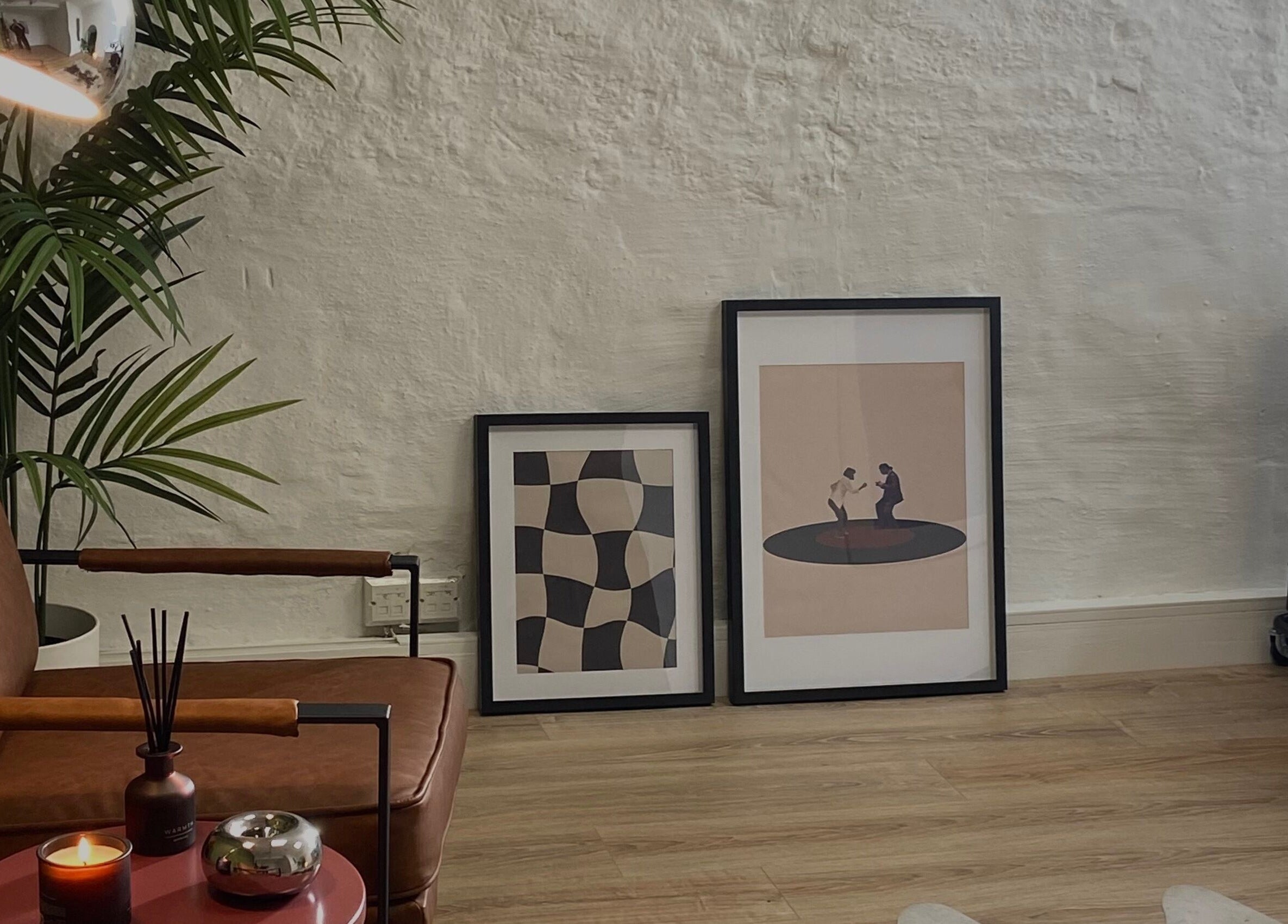 A cozy seating area at June Studios, Edinburgh, Scotland, GB, featuring modern art and comfortable decor.