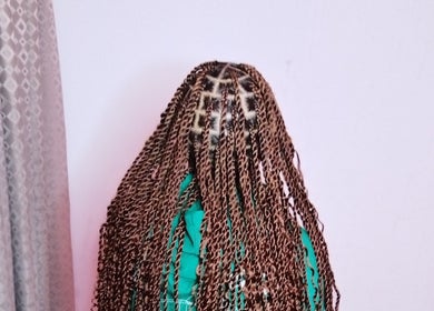 Intricate braiding hairstyle at TGT hair, Kempton Park, Gauteng, ZA, showcasing detailed craft and style.