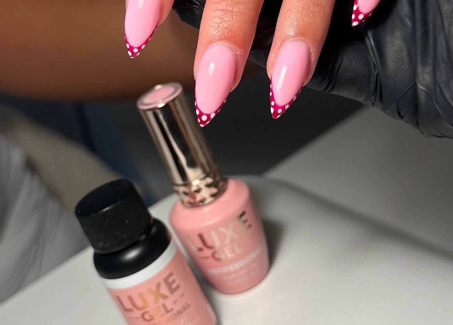 Elegant pink polka dot nails at Classyclaws, Dublin, County Dublin, IE, showcasing class and style.