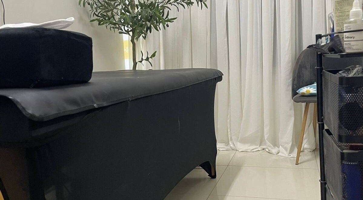 Relaxing treatment room at Donna Marie Skin Pharm, Old Harbour, St. Catherine Parish, JM, with massage table.