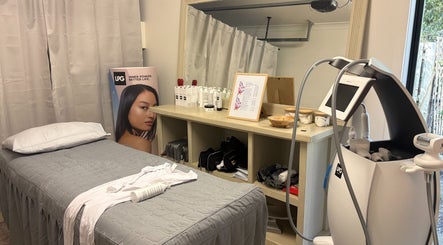 MedShape spa room in Peregian Springs, Queensland, AU with treatment bed, beauty equipment, and products.