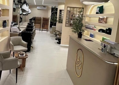 Elegant interior view of Elegance Beauty Home in Abuja, Federal Capital Territory, NG, featuring modern salon stations.