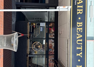 Entrance of Iconic Hair Beauty and Makeup in Hastings, Hawke's Bay Region, NZ, showcasing elegant signage.