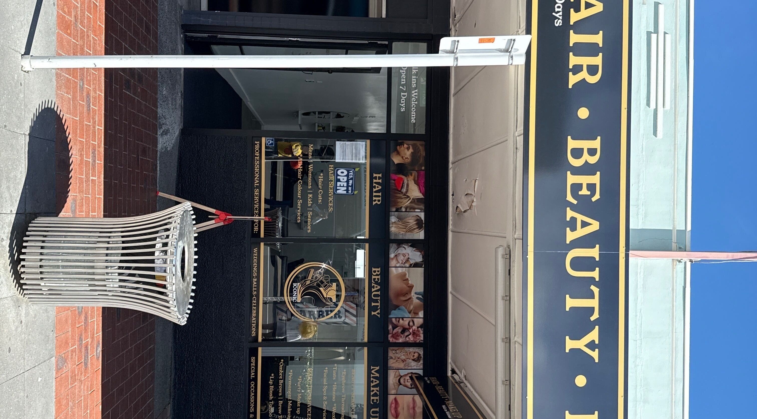 Entrance of Iconic Hair Beauty and Makeup in Hastings, Hawke's Bay Region, NZ, showcasing elegant signage.