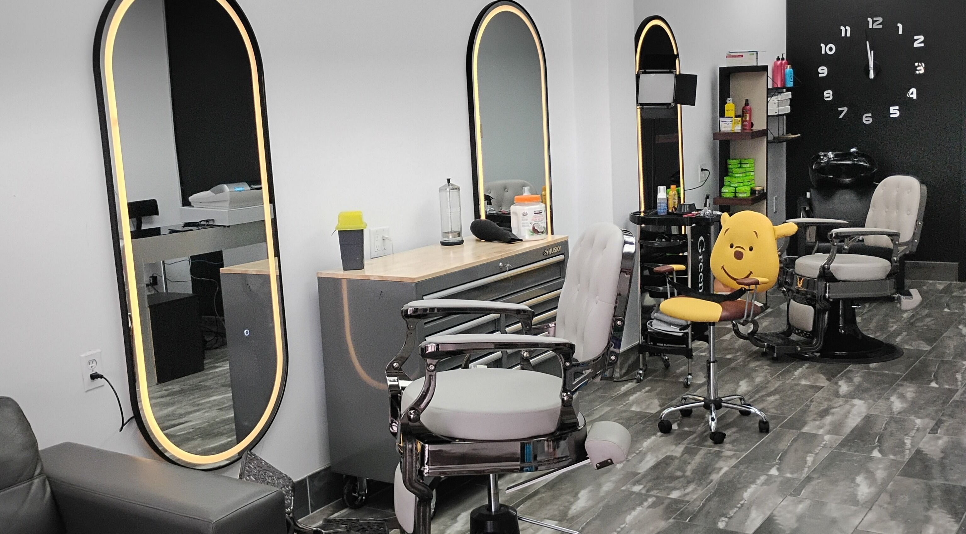 Modern salon interior at Shiny Hair Inc, London, Ontario, CA with stylish chairs and mirrors.