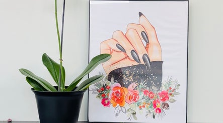 Framed nail art display with floral design at Nailstalgic✨, Lubbock, Texas, US.