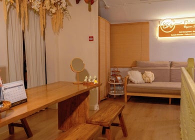 Relaxing interior of Caballe.M Spa, Singapore, SG, featuring wooden decor and cozy seating.