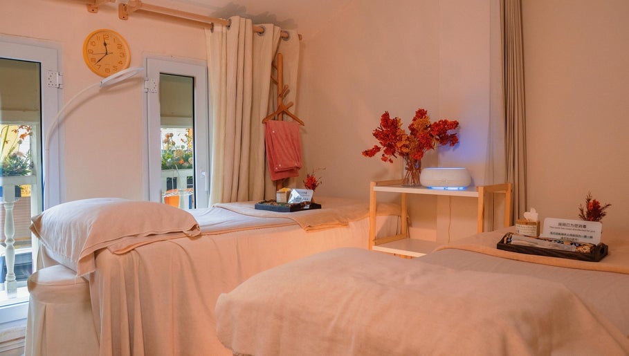 Relaxing treatment room at Caballe.M Organic Skin Spa - Toa Payoh, Singapore, SG with cozy beds and warm decor.