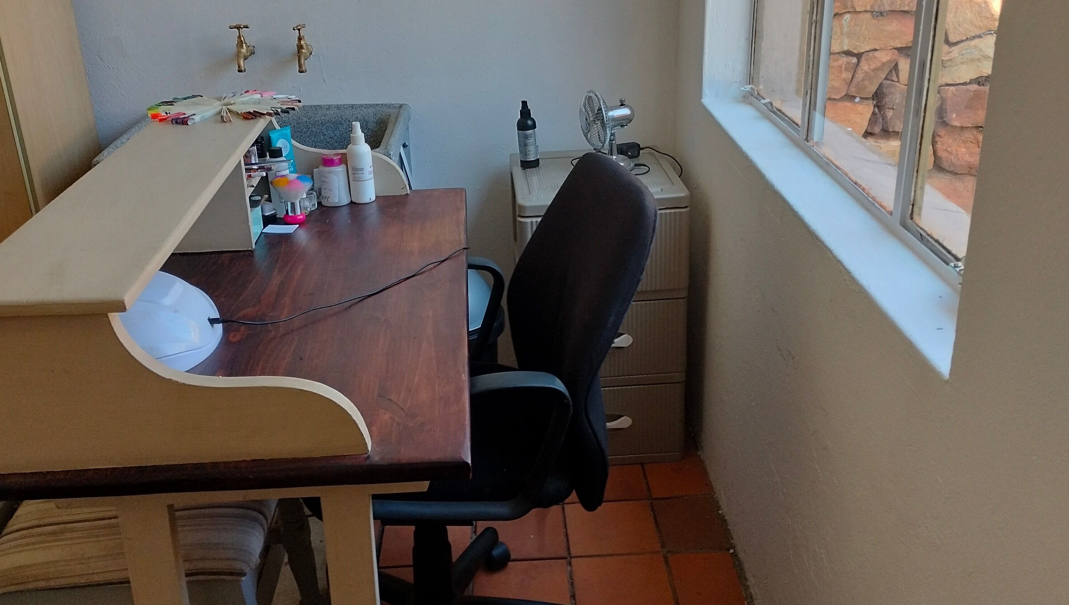 Nail station at Timeless Beauty Bar in Krugersdorp, Gauteng, ZA, featuring tools and comfortable seating.