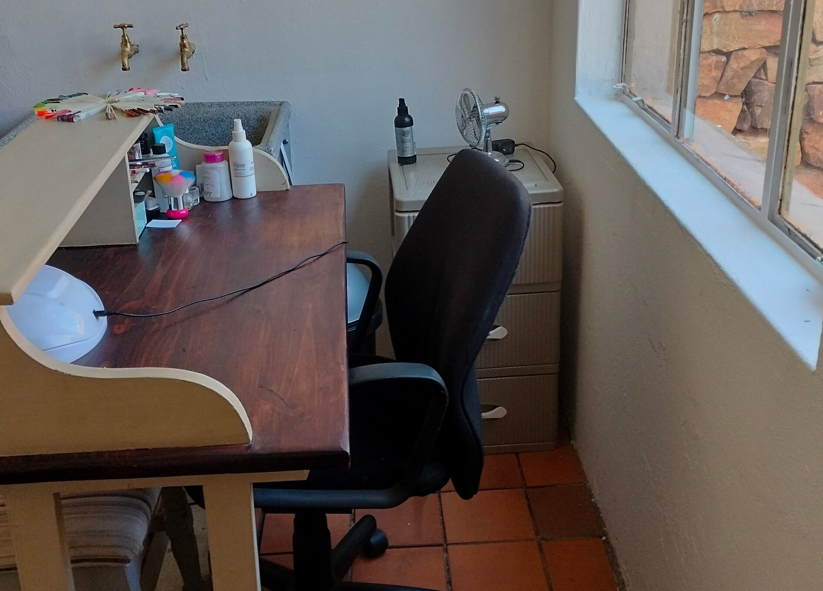 Nail station at Timeless Beauty Bar in Krugersdorp, Gauteng, ZA, featuring tools and comfortable seating.