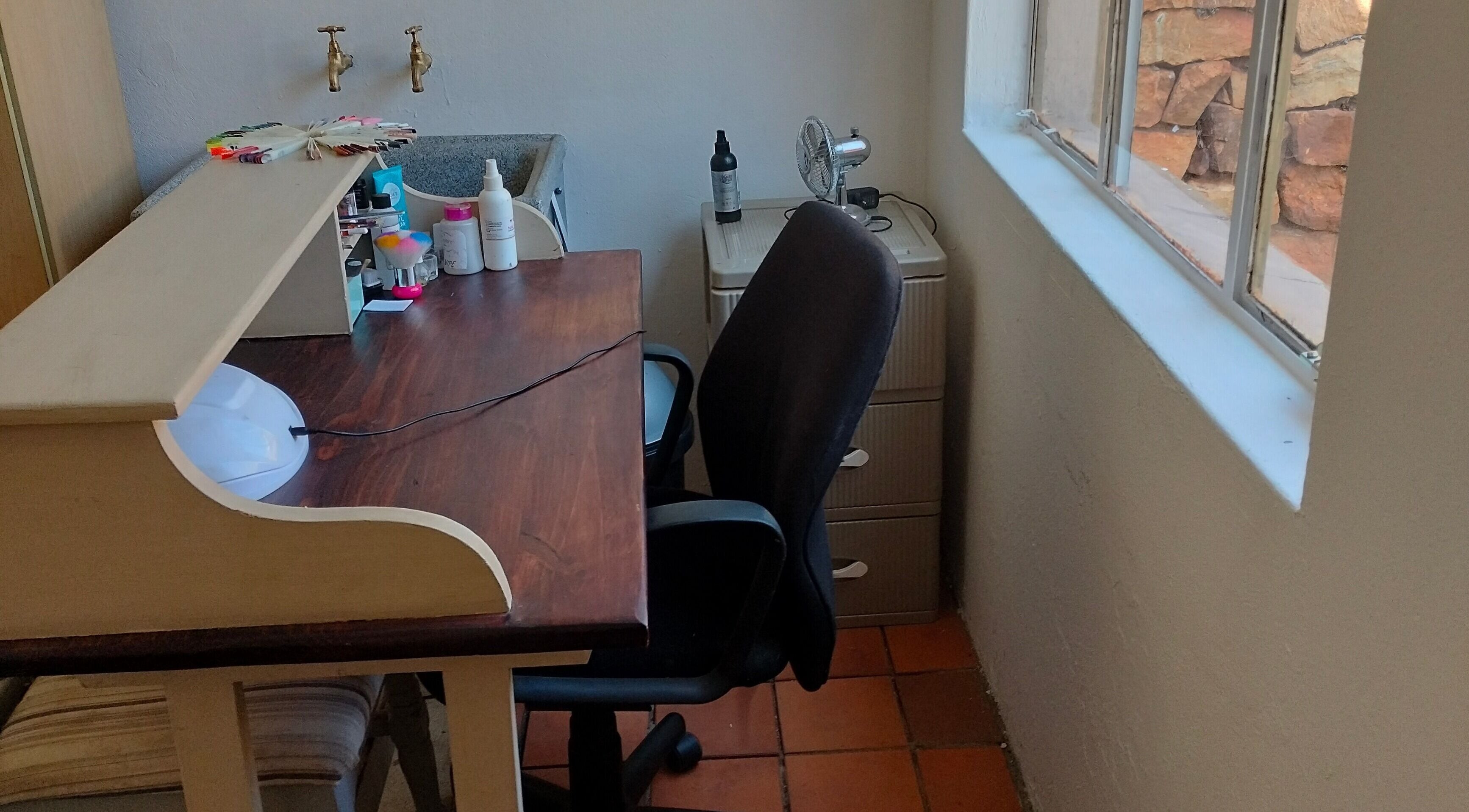 Nail station at Timeless Beauty Bar in Krugersdorp, Gauteng, ZA, featuring tools and comfortable seating.