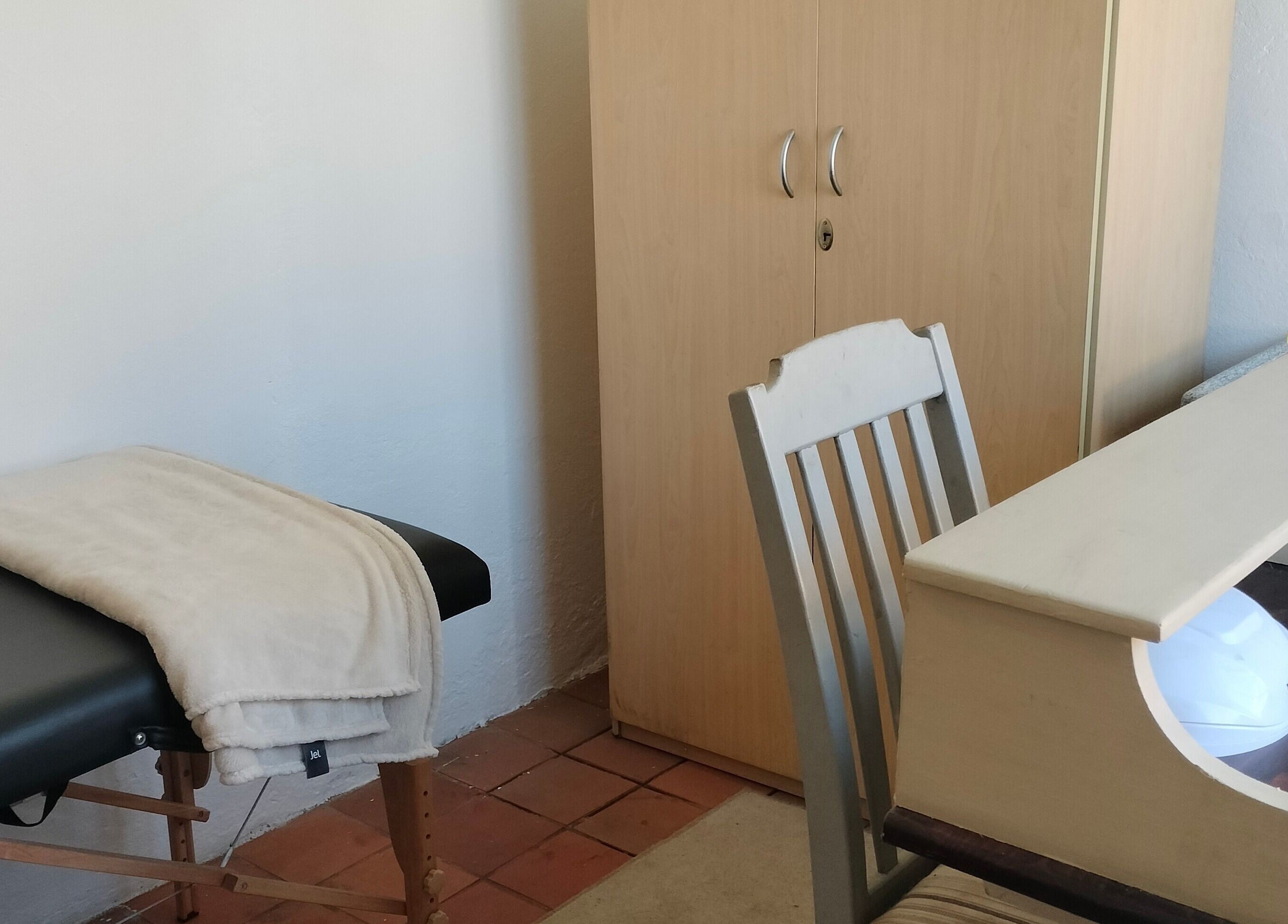 Calming treatment room at Timeless Beauty Bar in Krugersdorp, Gauteng, ZA, featuring a cozy massage table.