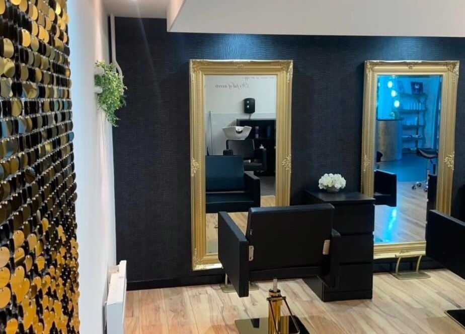 Elegant salon interior of Èlan by Ruby in Stornoway, Scotland, GB with mirrors, chairs, and stylish decor.