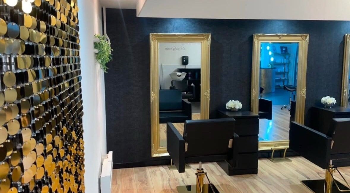 Elegant salon interior of Èlan by Ruby in Stornoway, Scotland, GB with mirrors, chairs, and stylish decor.